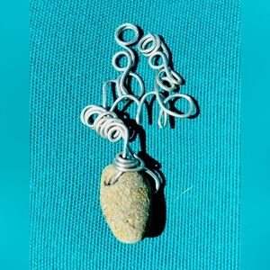 Wire wrapped natural finger lakes lucky stone pendant.
